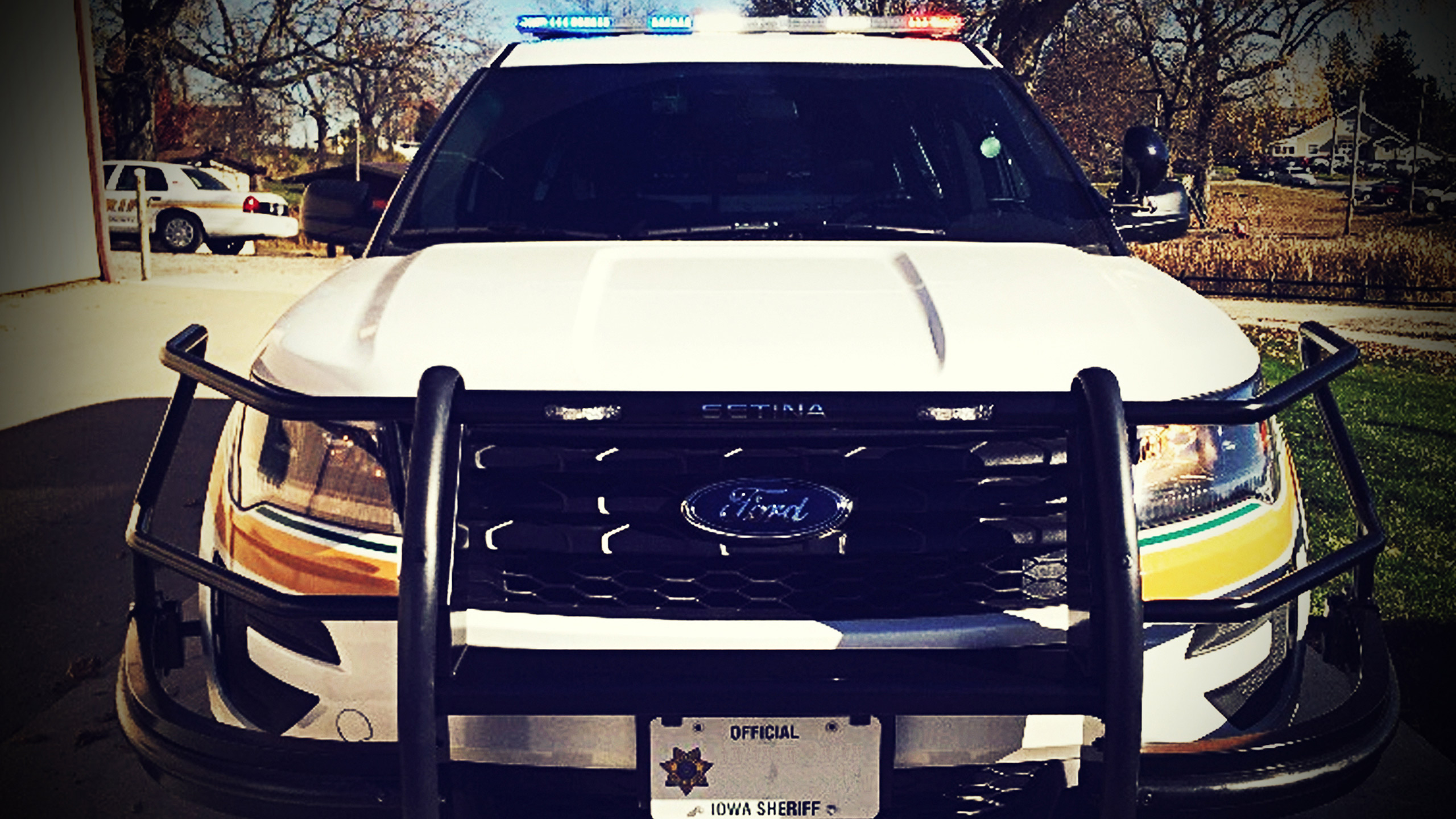 Close Up image of the front of a police cruiser outside the Keltek garage